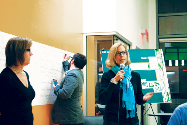 Downtown Express photo by Yannic Rack Landscape architect Lucinda Sanders, left, listened to suggestions from Wendy Chapman and dozens of other local residents at a community forum on Oct. 19. 