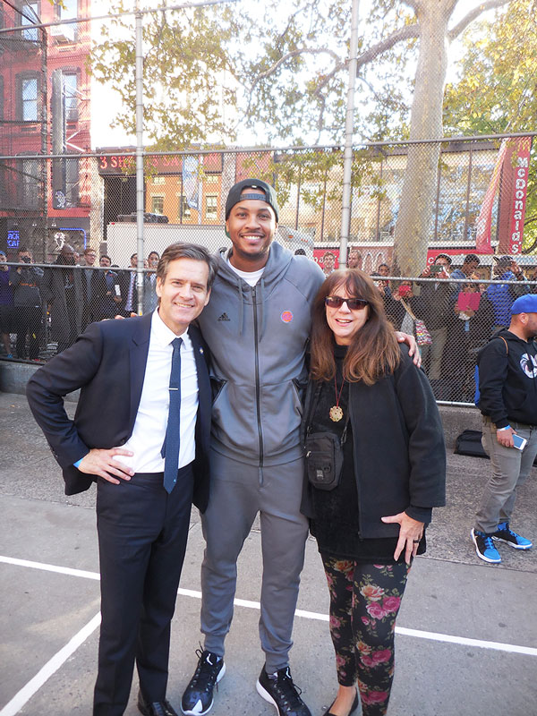 Hoylman and Sharon Woolums post up with Knicks superstar Carmelo Anthony.