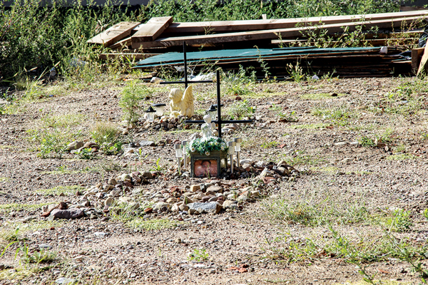 Downtown Express Photo By Yannic Rack The shapes of two graves have been marked out with stones and memorials left at the explosion site, in memory of Nicholas Figueroa and Moises Lucan, who both died in the fiery explosion at Second Ave. and E. Seventh St. on March 26.