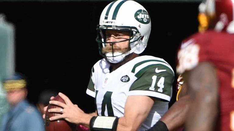 New York Jets quarterback Ryan Fitzpatrick (14) looks to pass against the Washington Redskins in the first half of an NFL football game at MetLife Stadium on Sunday, October 18, 2015.