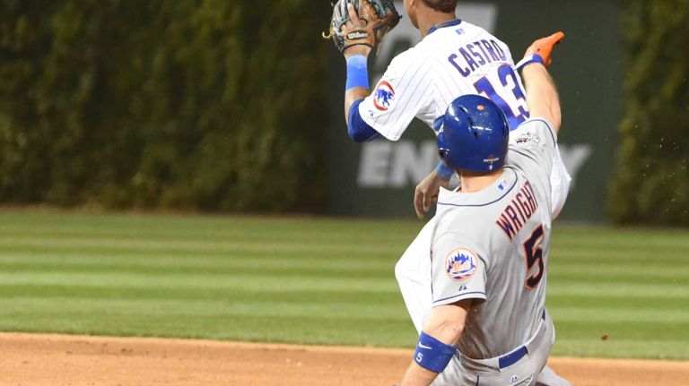 NLCS Game 3: Mets vs. Cubs 36 New York Mets third baseman David Wright hits a double in the seventh inning as Chicago Cubs shortstop Starlin Castro (13) waits for the throw during Game 3 of the NLCS at Wrigley Field on Tuesday, Oct. 20, 2015.