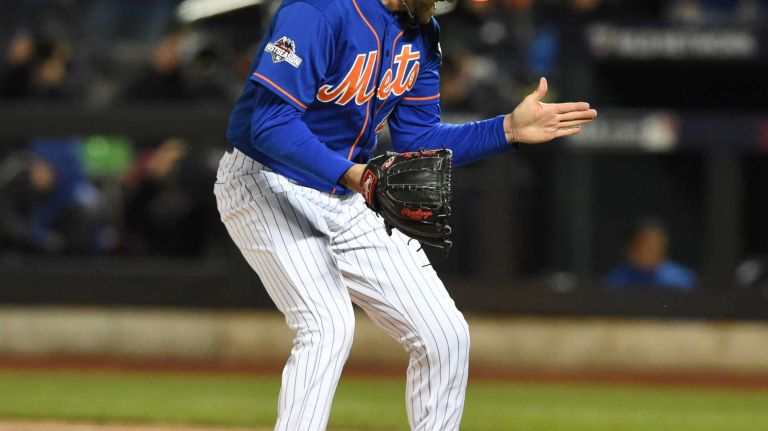 New York Mets starting pitcher Jonathon Niese (49) reacts to sticking out Chicago Cubs first baseman Anthony Rizzo (44) to end the sixth inning during Game 2 of the NLCS against the Chicago Cubs at Citi Field on Sunday, Oct. 18, 2015.