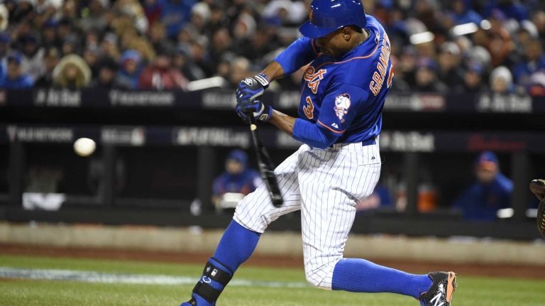 New York Mets right fielder Curtis Granderson (3) smacks a single in the first inning during Game 2 of the NLCS against the Chicago Cubs at Citi Field on Sunday, Oct. 18, 2015.