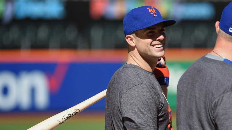 New York Mets third baseman David Wright talks with Michael Cuddyer during a workout day at Citi Field on Tuesday, October 6, 2015.