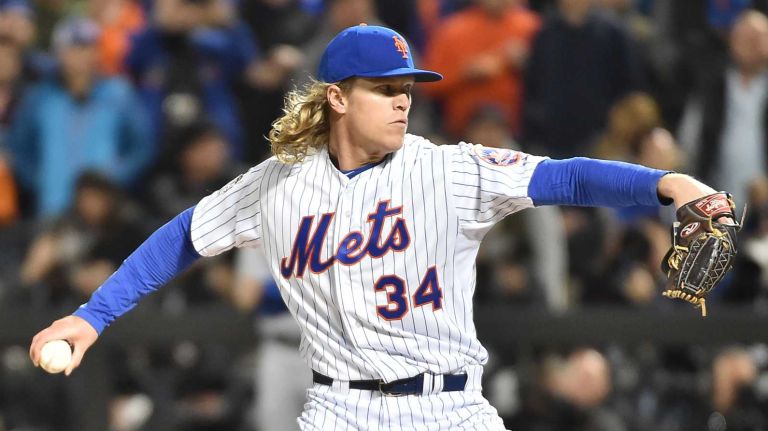 New York Mets starting pitcher Noah Syndergaard (34) delivers the pitch in first inning during Game 3 of the World Series against the Kansas City Royals at Citi Field on Friday, Oct. 30, 2015.
