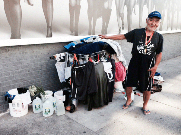 City swipes homeless man’s stuff for second time 1 Katsuyuki on Clarkson St. two weeks ago next to his cart and possessions. Photos by Joanna Purpich
