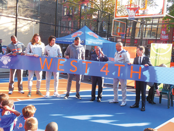 Cutting the ribbon on the spruced-up courts, from left, Arron Afflalo, Lou Amundson, Sasha Vujacic, Carmelo Anthony, Parks Commissioner Mitchell Silver, John Starks and state Senator Brad Hoylman.