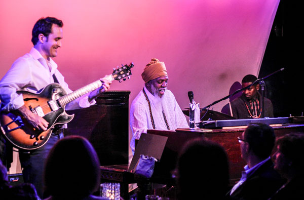 Jamming with the members of his trio.