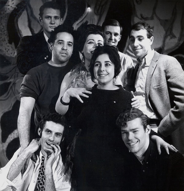 'Magic Time' at the Caffe Cino 3 The cast and crew of “Why Hanna's Skirt Won't Stay Down” (1965). Its playwright, Tom Eyen, at right in sports jacket; Joe Cino, left, with shirt sleeve rolled up; stage manager Magie Dominic at center, in black. Photo by James Gossage.
