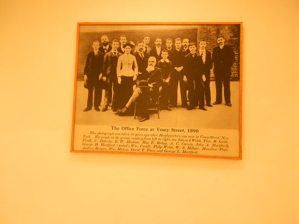 Photo by Mary Reinholz A vintage photo of the A&P chain’s founders and staff hangs on the wall at the E. 15th St. Food Emporium supermarket, now under Key Food ownership. A&P started out on Vesey St. in Lower Manhattan.