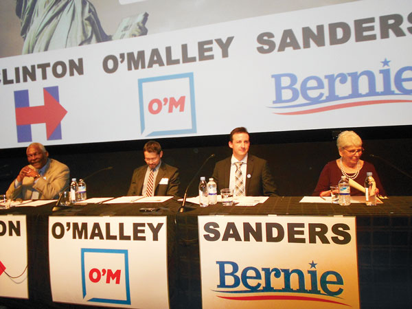 Photo by Mary Reinholz Representing the candidates, from left, Keith Wright (for Hillary Clinton), Adam Stolz (for Martin O’Malley) and Sean Patrick Murphy (for Bernie Sanders), with moderator Ronnie Eldridge.