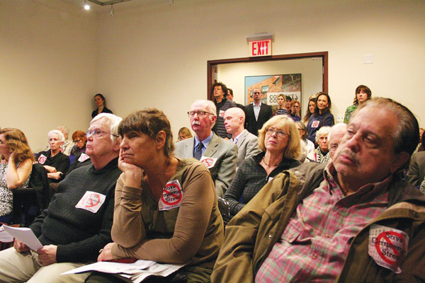 Meatpacking plan would butcher iconic block, say opponents at Landmarks 3 Photo by Yannic Rack Villagers, shown listening to testimony at the Landmarks Preservation Commission, turned out in numbers to speak out against the plan.