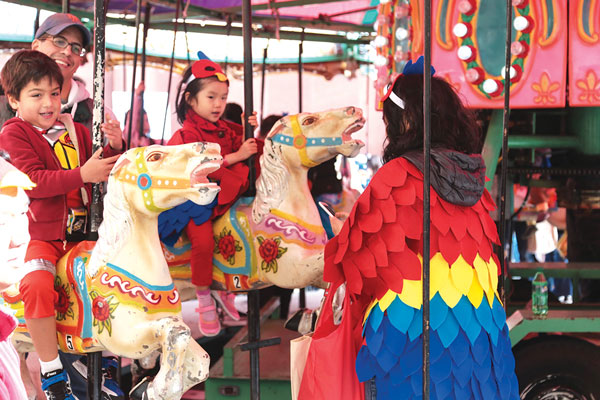 Kids enjoy ‘other’ parade so much, that it’s scary! 3 Kids enjoyed taking a spin on the carousel.