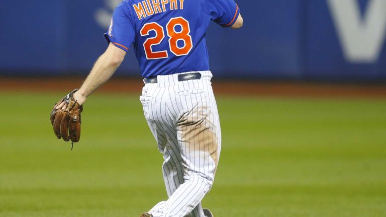 World Series Game 5: Mets vs. Royals 108 New York Mets second baseman Daniel Murphy (28) makes an error in the 12th inning during Game 5 of the World Series against the Kansas City Royals at Citi Field on Sunday, Nov. 1, 2015.