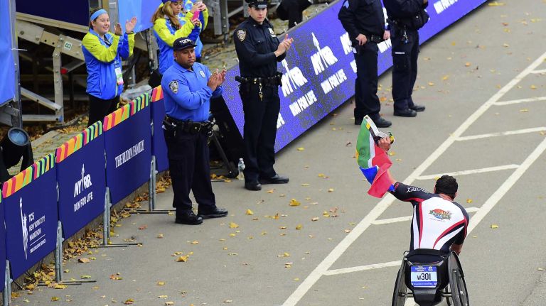 Ernst Van Dyk of South Africa celebrates after winning the Men's Pushrim New York City Marathon in Manhattan on Sunday, Nov. 1, 2015.