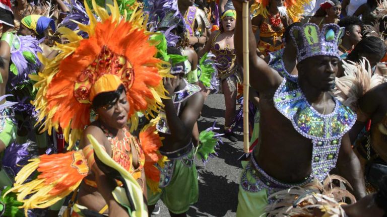 NYC pictures of 2015: Pope Francis, Pizza Rat, Shia LaBeouf, Donald Trump and more 19 Paradegoers march and dance in the annual West Indian American Day Parade in Brooklyn on Sept. 7, 2015.