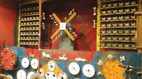 A nearly full view of the vintage Mangels shooting gallery. The holes in the white circles, at bottom, were bull’s-eyes.