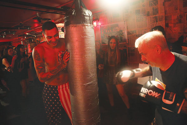 Dr. Dave Ores worked on the heavy bag, held by Dan Halen.