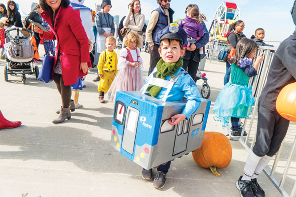 Kids crowd Pier 26 for Happy Halloween 1 Downtown Express photo by Milo Hess Train buff Jacob Krautmann came to the Halloween Kidz Carnival Pier 26 dressed as a PATH train in a costume made by him mom, Elizabeth Lara.
