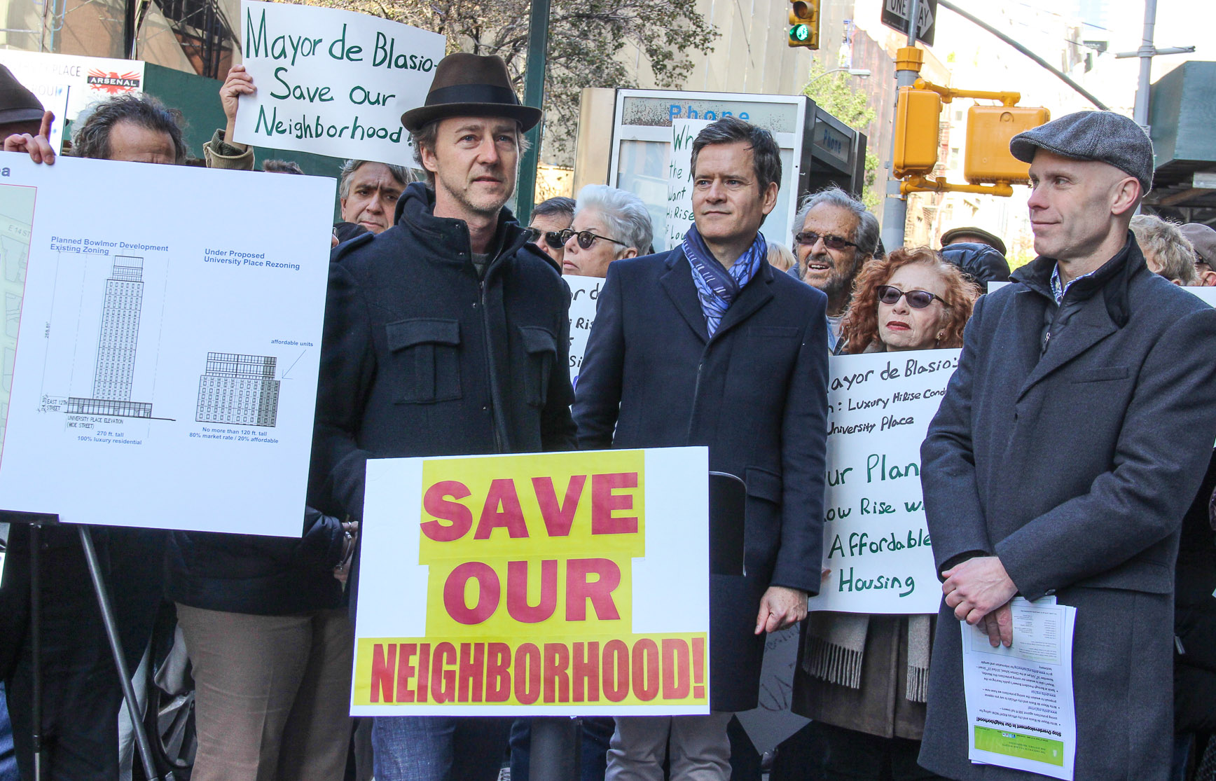 Actor Edward Norton, speaking, at center, said that development can't be allowed to "compromise the city's DNA." To the right of him are state Senator Brad Hoylman and preservationist Andrew Berman. At left, C.B. 2 Chairperson Tobi Bergman, holds up comparative renderings of the current Macklowe project and how it would look -- much squatter -- under the proposed rezoning. Photos by Tequila Minsky