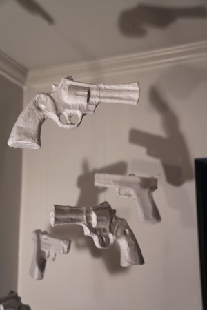 Two blocks of L.E.S. fame 4 Ethan Minsker’s “Ghost Guns” installation has the titular objects moving in unpredictable directions, reflecting the randomness of being targeted and killed. Photo by Ethan Minsker.