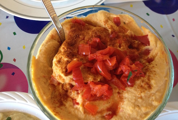 Let’s Get This Party Started: Healthy Holiday Appetizers 1 Make hummus festive by adding chopped red peppers and some green parsley on top at the end. | CARLYE WAXMAN-HUSSERL