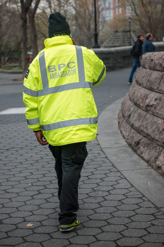 Photo by Milo Hess The Battery Park City Authority hired private security contractor AlliedBarton to provide yellow-clad “ambassadors” to patrol the neighborhood, replacing most of the city’s Park Enforcement Patrol. 