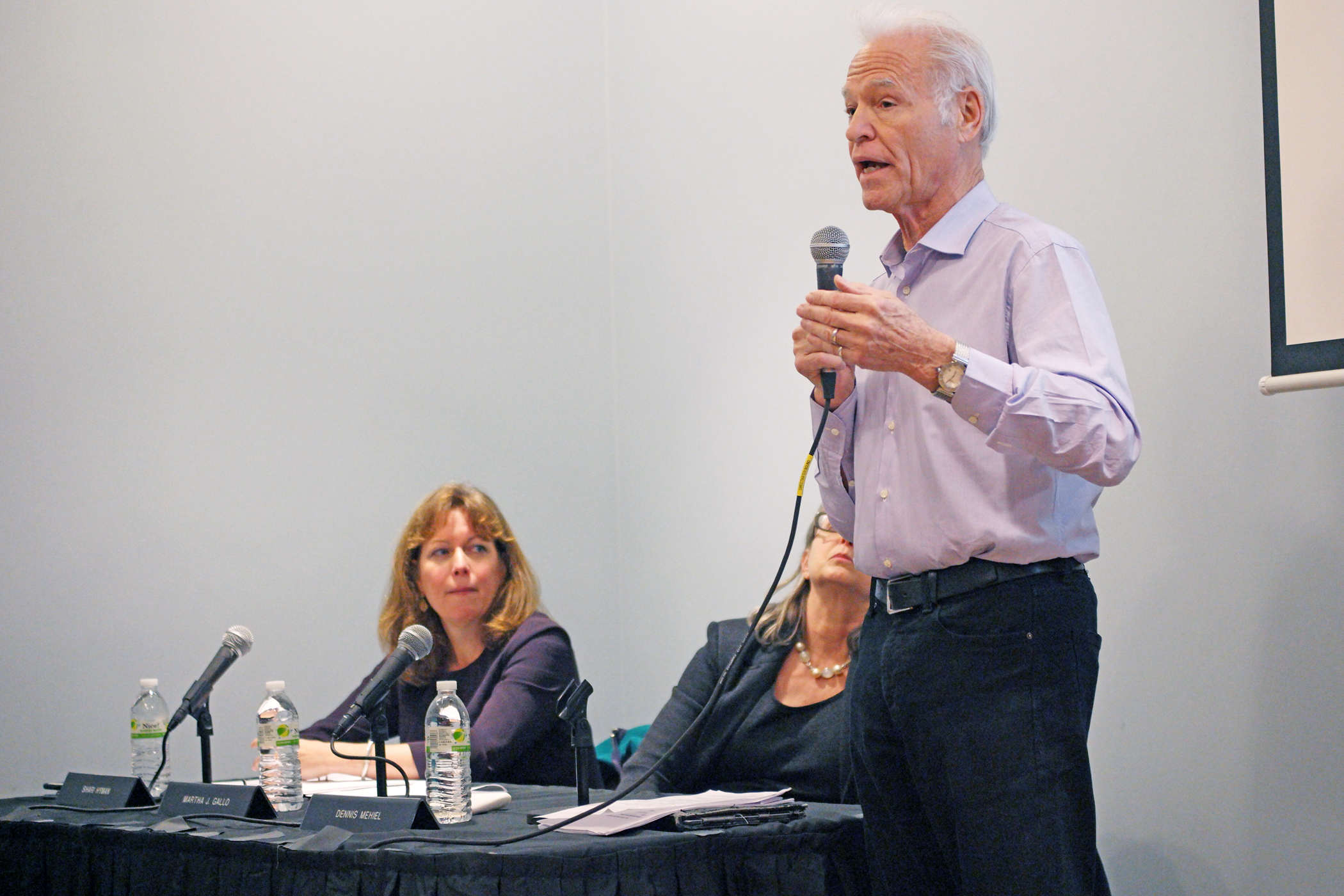 Photo by Milo Hess Battery Park City Authority board chairman Dennis Mehiel, right, joined by board president Shari Hyman, left, and member Martha Gallo, took questions from residents at a Dec. 16 forum.