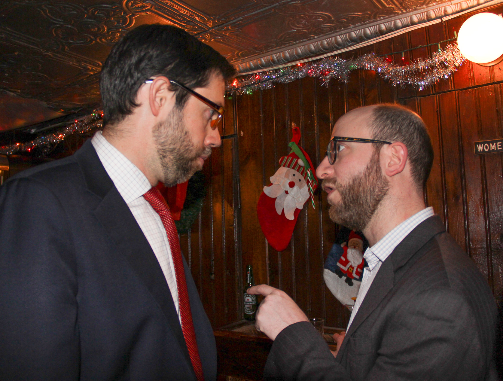 State Senator Daniel Squadron, left — speaking with Assembly hopeful Paul Newell at the Downtown Independent Democrats holiday party — favors reforming the special-election process.