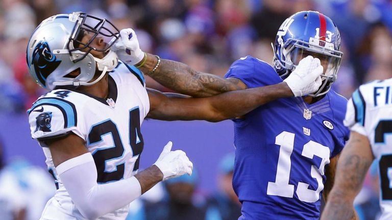 Odell Beckham #13 of the New York Giants mixes it up after a play in the first half against Josh Norman #24 of the Carolina Panthers at MetLife Stadium on Sunday, Dec. 20, 2015 in East Rutherford, N.J.