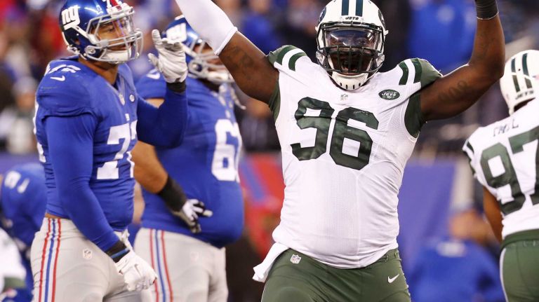 Muhammad Wilkerson #96 of the New York Jets celebrates after defeating the New York Giants in overtime at MetLife Stadium on Sunday, Dec. 6, 2015 in East Rutherford, N.J.