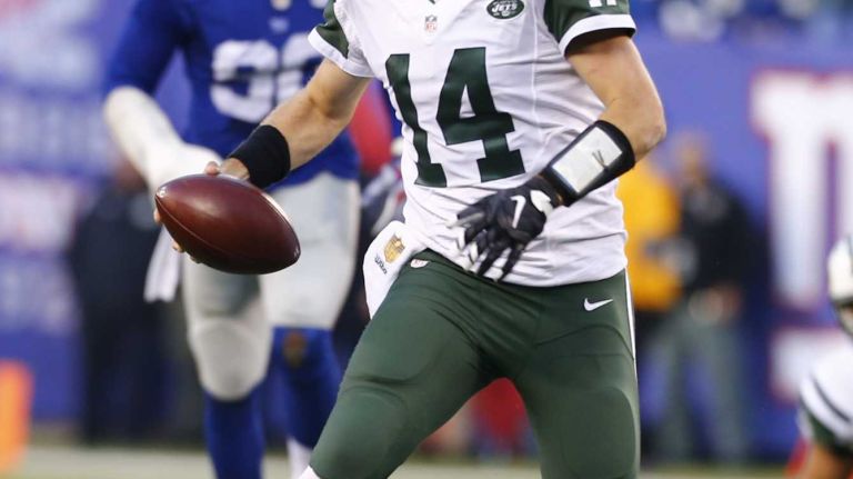 Ryan Fitzpatrick #14 of the New York Jets scrambles with the ball for a first down in the fourth quarter against the New York Giants at MetLife Stadium on Sunday, Dec. 6, 2015 in East Rutherford, N.J.