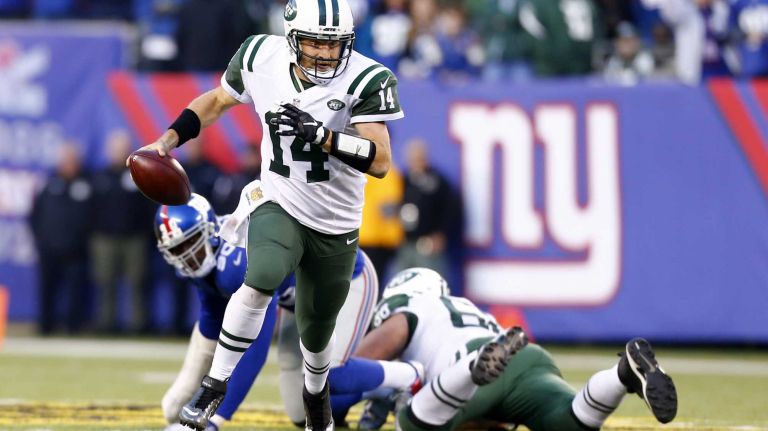 Ryan Fitzpatrick #14 of the New York Jets scrambles with the ball for a first down in the fourth quarter against the New York Giants at MetLife Stadium on Sunday, Dec. 6, 2015 in East Rutherford, N.J.