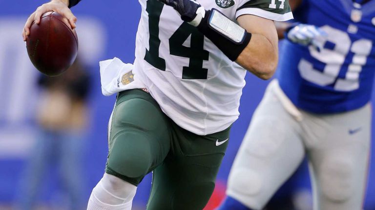 Ryan Fitzpatrick #14 of the New York Jets scrambles in the first half against the New York Giants at MetLife Stadium on Sunday, Dec. 6, 2015 in East Rutherford, N.J.