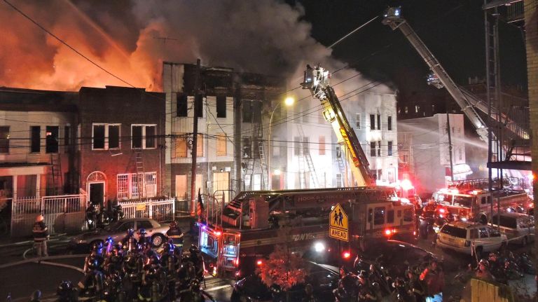 A massive,  six- alarm fire ripped through multiple row houses in the Bronx  on Valentine Avenue, late Thursday night, Dec. 10, 2015. Dozens of people have been displaced. 
