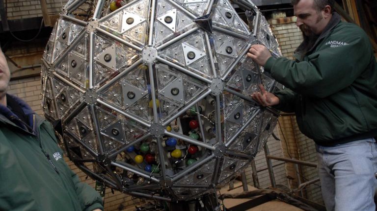Times Square New Year's Eve celebrations through the years 11 Workers install the 72 new crystal triangles featuring the