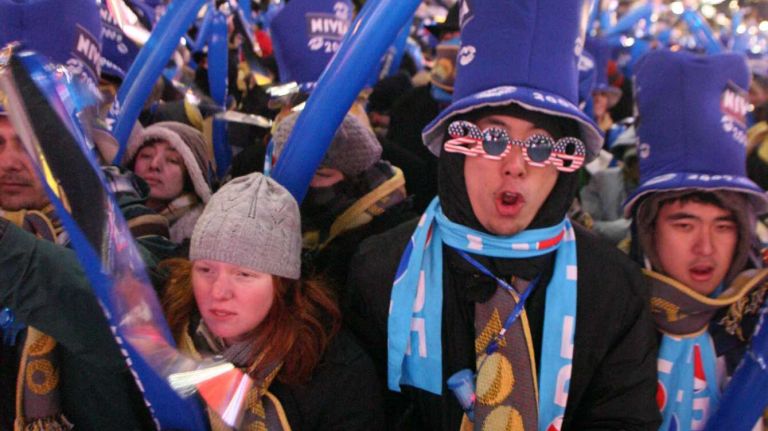 Times Square New Year's Eve celebrations through the years 13 People play with their balloons as they wait for the traditional New Year's Eve ball drop in Times Square in Manhattan on Dec. 31, 2008.