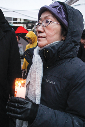 City Councilmember Margaret Chin held a votive candle at the memorial.   Photos by Tequila Minsky