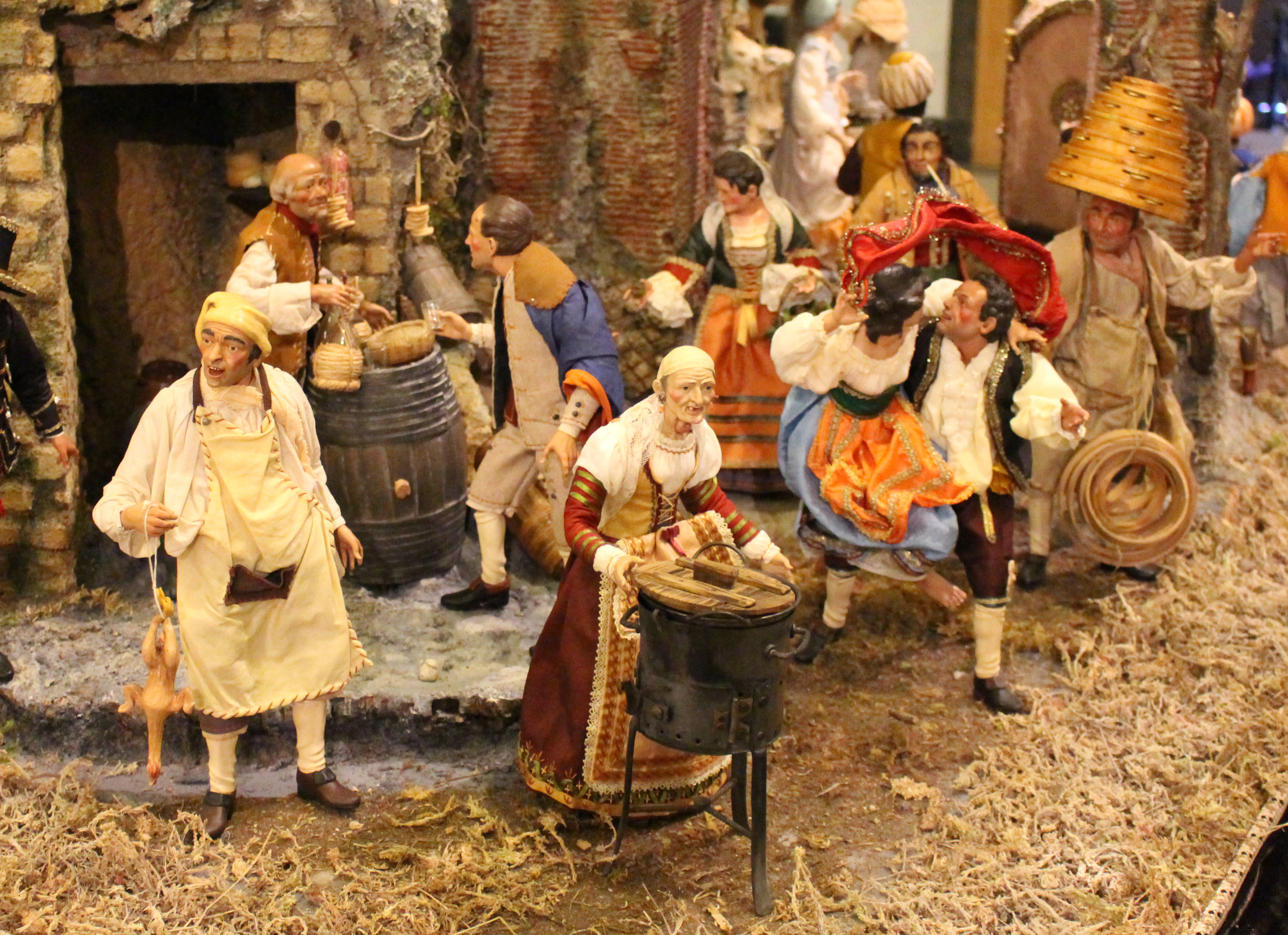 Nativity of mercy: Neapolitan display on LES evokes theme of Holy Year 3 Photo by Bill Egbert In addition to strictly Christian characters, A Neapolitan presepio features traditional Italian characters, such a merchants of goods that represent different months of the year – the chicken vendor represent the month of March, for example, while the vendor roasting chestnuts represents November. To the right, a couple dances the Tarantella, a dance typical of southern Italy, while a musician plays the tammorra – or tambourine.