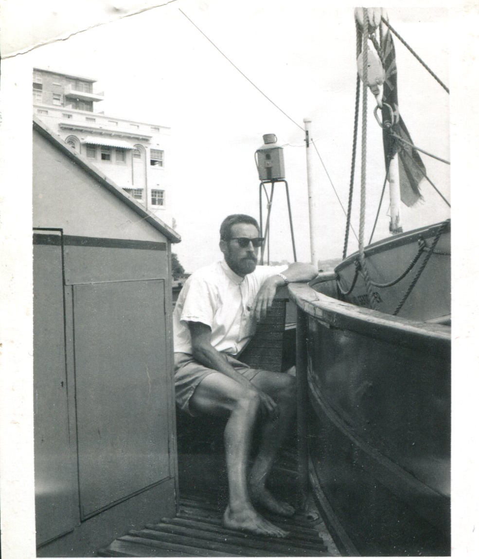 A photo from December 1966 of David Lloyd Wilkie at age 36 in Australia, perhaps on a boat or ferry. "For Jenean and Lenore — with my love, Lloyd," he wrote on the back.