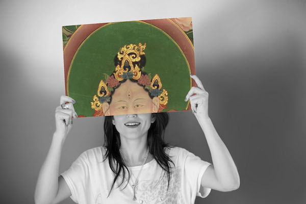 Woman holding blank white board