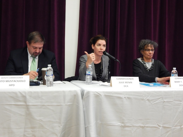 Q&A and Assurances at Crowded Town Hall 2 Commissioner Julie Menin of the Department of Consumer Affairs discussed the extension of paid sick leave to over a million New Yorkers. Deputy Commissioner Vito Mustaciuolo of the Housing Preservation and Development Department on left, and Commissioner Mary T. Bassett of the Department of Health and Mental Hygiene on right. Photo by Lindsay Bu.