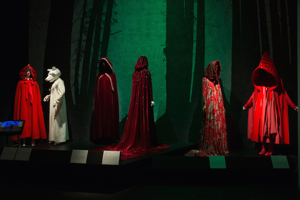 Once upon a time, told with style 4 Clothing illustrating “Little Red Riding Hood.” L to R: 18th century cloak, 19th century nightgown, 1970s cloak by Giorgio di Sant’Angelo, cloak by Altuzarra, dress by Dolce and Gabbana, ensemble by Comme des Garçons. Chanel No. 5 video courtesy of Chanel. © 2016 The Museum at FIT.