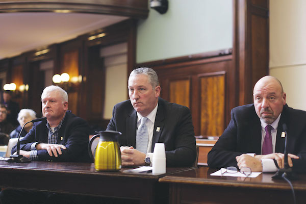 Confusion Reigns at City Council Carriage Hearing 1 Representatives of the carriage industry spoke out against the bill. From left, Conor McHugh, manager of Clinton Park Stables on W. 52nd St., carriage owner Stephen Malone, and Demos Demopoulos, secretary-treasurer of the Teamsters union. Photo by William Alatriste/NYC City Council.