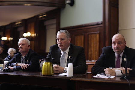 De Blasio Not Yet in the Saddle on Horse Carriages 2 Representatives of the carriage industry –– including Conor McHugh, manager of Clinton Park Stables on West 52nd Street, carriage owner Stephen Malone, and Demos Demopoulos, secretary-treasurer of the Teamsters Union –– spoke out against the bill at the hearing. | WILLIAM ALATRISTE/ NEW YORK CITY COUNCIL