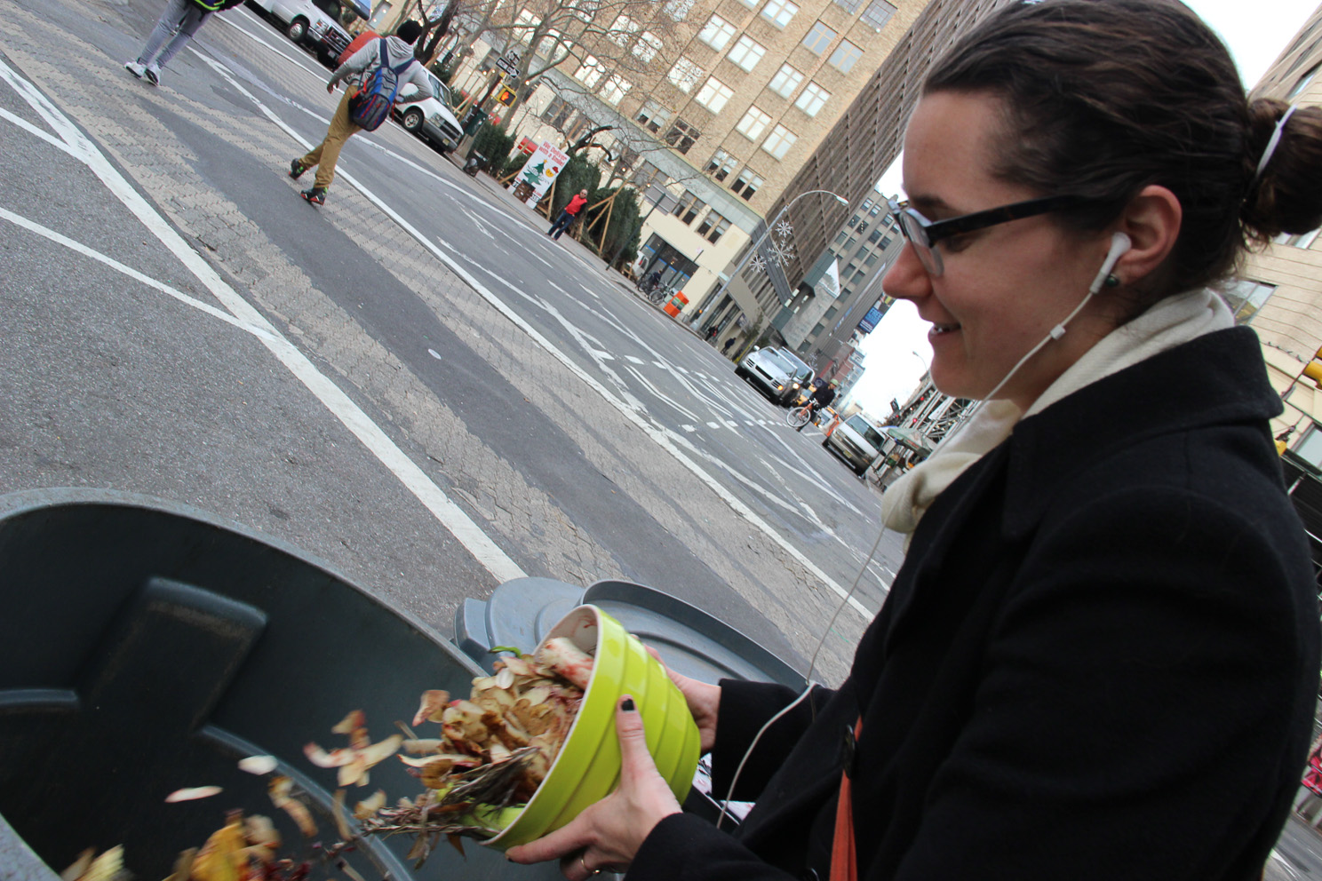 Dumping vegetable scraps at Spring St. and Sixth Ave. at the composting drop-off spot. Photos by Tequila Minsky