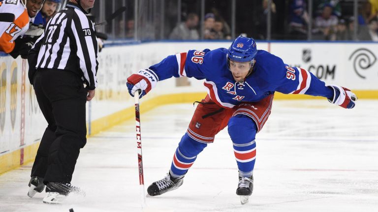 New York Rangers right wing Emerson Etem chases after the puck against the Philadelphia Flyers during the third period of an NHL preseason hockey game at Madison Square Garden on Monday, Sept. 28, 2015.