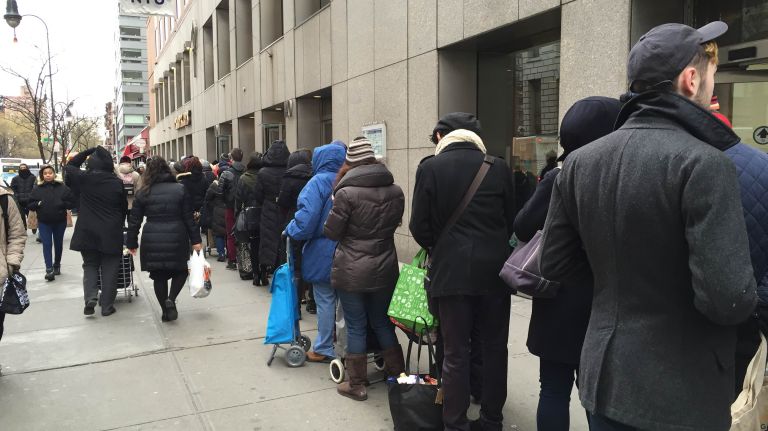 Dozens of people line up to get groceries at the Trader Joe's in Union Square on Friday, Jan. 22, 2016, ahead of a major winter storm expected to blanked the city on the weekend. 
