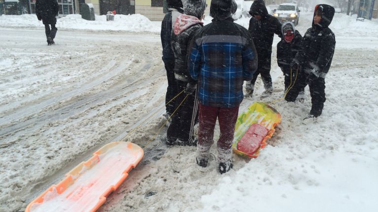 Kids dragging sleds in Bay Ridge, Brooklyn, on Jan. 23, 2016.