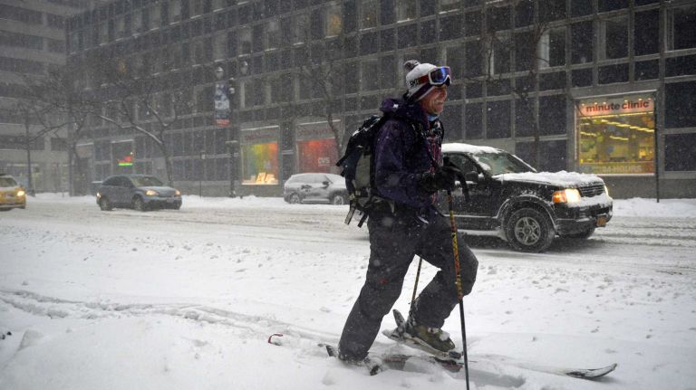 Manhattan resident Adam Kaslow (33) uses his cross-country skis to travel around the city during a snowstorm on Saturday, Jan. 23, 2016. A snow emergency is currently in effect as accumulations in the city could top out at over a foot before the storm is expected to end this evening.
